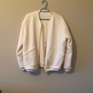 Whitney Simmons white bomber jacket